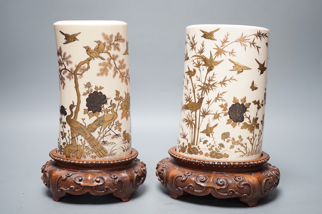 A graduated set of two Japanese gilt lacquered ivory vases, Meiji period, wood stands. Total height 21.5cm